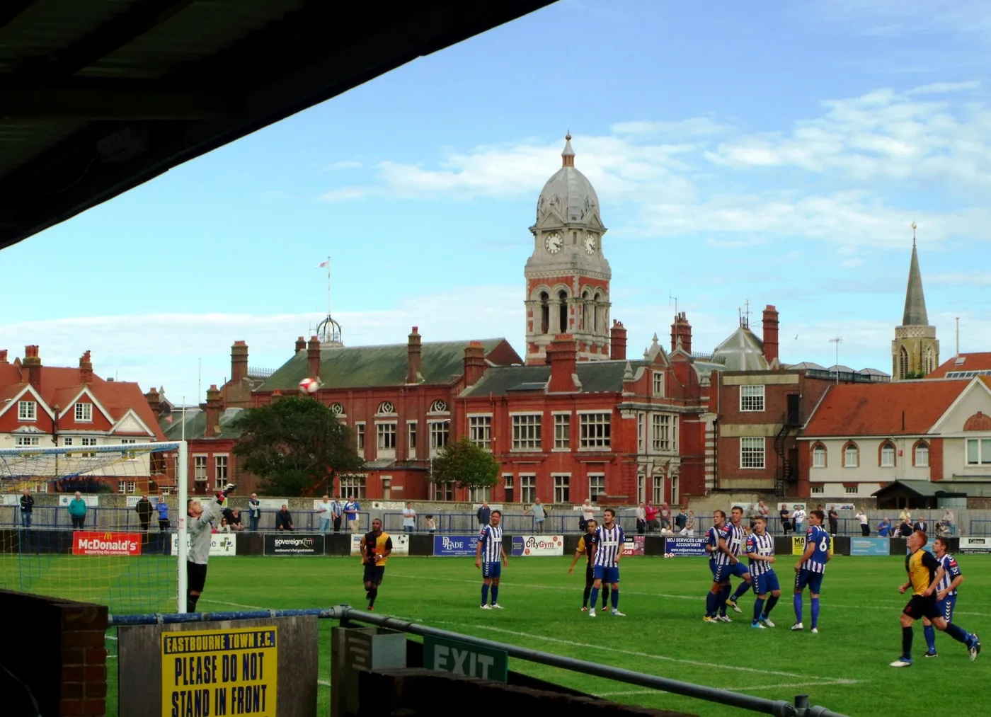 The Saffrons on Compton Place Road on a match day, with the Town Hall clock tower behind